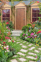Landscaped backyard of house with flower garden