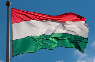 Naklejka na ściany i meble Hungarian flag waving in the wind