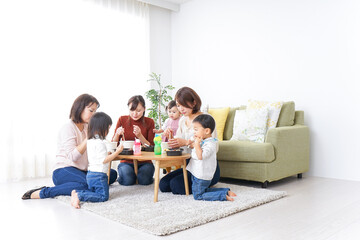 Mothers' friends and children doing party