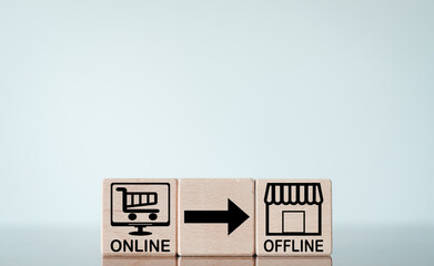 online market to offline market concept.,online market and offline market icon on wooden cube with copyspace.