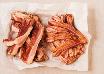 Raw slices of bacon in butcher paper