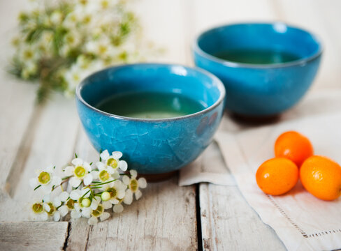 Two Asian Style Tea Cups with Kumquats