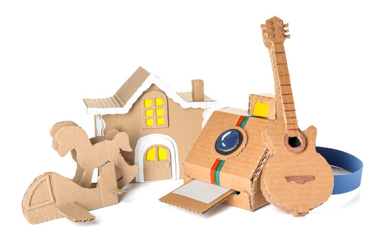 Different cardboard toys on white background