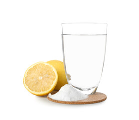 Glass of water, baking soda and  lemon on white background