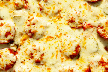 Obraz na płótnie Canvas Delicious vegetarian pizza texture with champignon mushrooms, tomatoes, mozzarella.