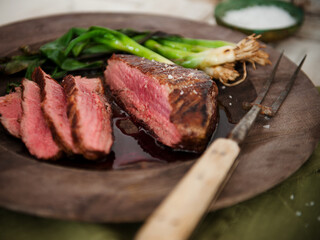 Sliced Wagyu Steak with Green Onion; Carving Fork