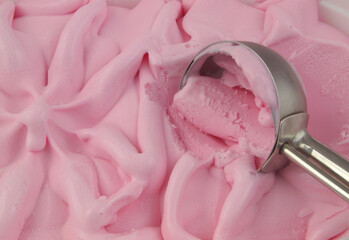 Strawberry ice cream and scoop 