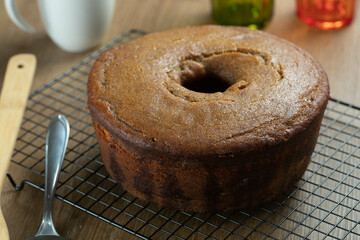 Brazilian corn cake made with a type of corn flour (Fuba). On a wooden party table. Typical sweets of the June festival. Cornmeal cake
