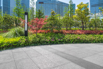 empty pavement and modern buildings in city.