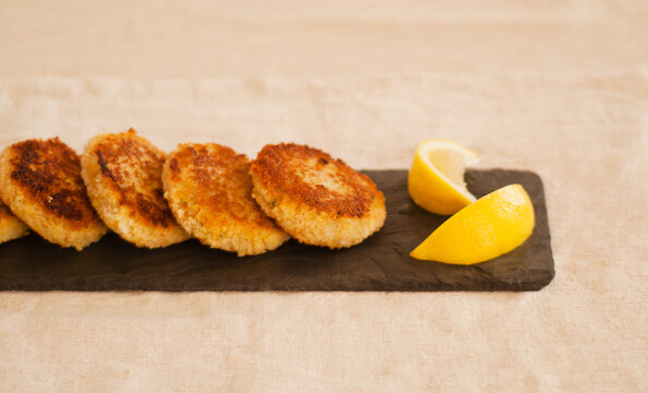 Crab Cakes on Slate with Lemon.