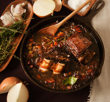 Braising black angus beef with herbs and vegetables 