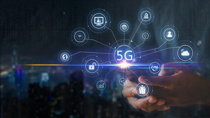 Fototapeta na wymiar Hand of business man hold mobilephone connect network 5G with icon concept, technology network wireless systems and internet of things, new technologies coming up in the future. Network connection 5G