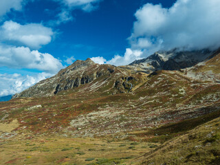 Alpine mountains range landscapes at swiss Alps at SWITZERLAND with fantastic rocky scenery seen, cloudy blue sky. Tour du Mont Blanc