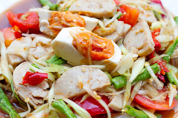 Spicy papaya salad with salted egg and vietnamese pork sausage