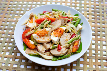 Spicy papaya salad with salted egg and vietnamese pork sausage