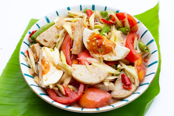 Spicy papaya salad with salted egg and vietnamese pork sausage