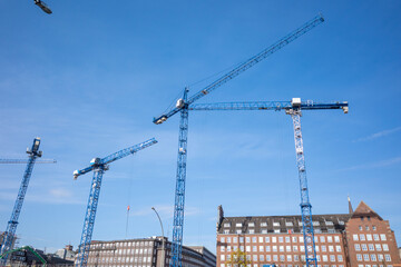 on a large construction site are construction cranes