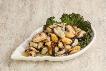 Tasty marinated mussels in the bowl