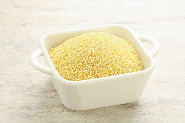Raw couscous in the bowl