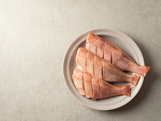 trimmed red rockfish on a plate