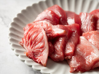 Tuna sashimi in various parts on a plate