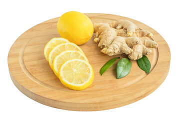 Fresh ginger roots with sliced lemon pieces and whole on a cutting kitchen board, white isolated background.