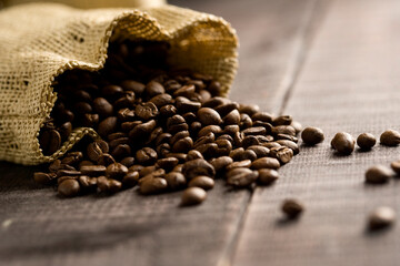coffee beans in a sack on dark background,