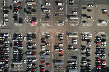 Aerial view of parking lot near shopping mall, Top view of parked cars on parking spots, City transport