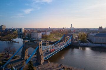 Fototapeta na wymiar Aerial panorama of Wroclaw city with car bridge over Odra river in Poland, Urban cityscape with historical european architecture