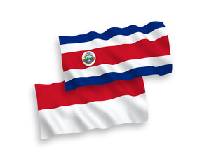 National vector fabric wave flags of Indonesia and Republic of Costa Rica isolated on white background. 1 to 2 proportion.