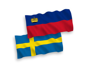 National vector fabric wave flags of Sweden and Liechtenstein isolated on white background. 1 to 2 proportion.