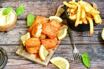   Allasca Pollock Fish  Bites in a crispy Tempura  Batter.Fish and chips .Close up of   crispy...