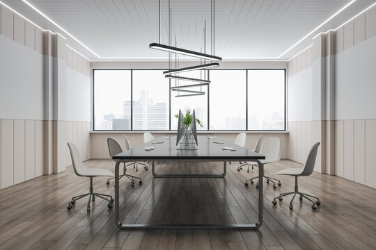 Modern concrete coworking office interior with panoramic city view, wooden flooring, empty computer monitors on desks and chairs. 3D Rendering.