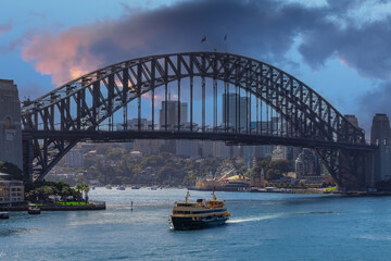 Sydney Harbour Australia with nice colours in the sky. Nice blue water of the Harbour, high rise offices and residential buildings of the City in the background, NSW Australia