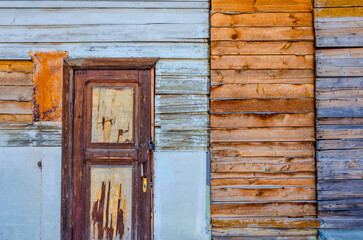 An old wooden wall with doors.