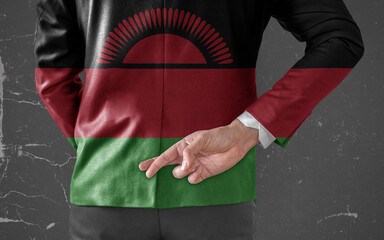 Businessman Jacket with Flag of Malawi with his fingers crossed behind his back