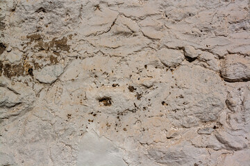 Texture of old wall stained with mortar. Horizontal photo.