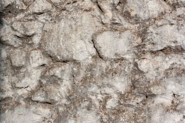 Smooth wall of old blocks of different sizes on mortar. Horizontal photo.