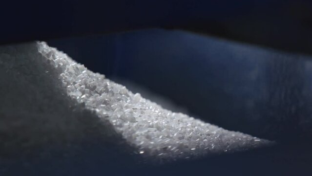 Plastic Granules Are Poured Into the Machine.Raw Material.Recycling.Clouseup