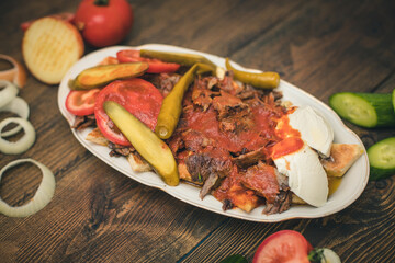 turkish national food iskender or iskender kebab with yogurt and herbs