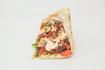 doner or shawarma in a Central Asian flatbread on a white background