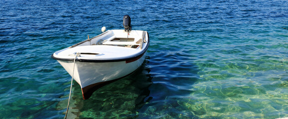 white boat in the clear waters of N.P. Mljet, island Mljet, croatia