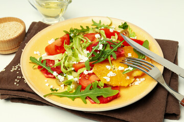 Concept of tasty food, salad with red orange, close up