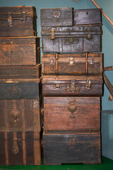 Pile of old vintage big wooden boxes stacked in a furniture store - obrazy, fototapety, plakaty