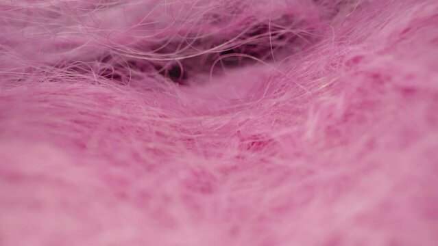 pink woolen fabric, thread. Dolly slider extreme close-up inside. Laowa Probe