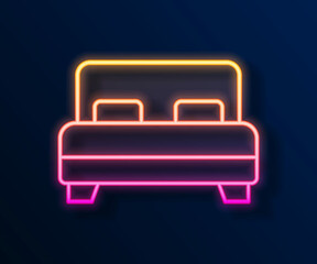 Glowing neon line Big bed for two or one person icon isolated on black background. Vector