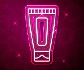 Glowing neon line Cream or lotion cosmetic tube icon isolated on red background. Body care products for woman. Vector