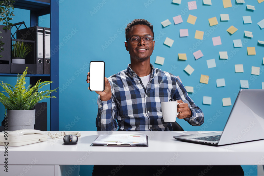 Poster project manager pointing phone device with mockup display to camera. young adult business person sit