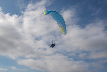 First flight with a tandem paragliding instructor. Photo taken from the El Toro lookout point, municipality of Es Mercadal, Menorca, Spain