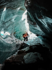 person climbing on rock